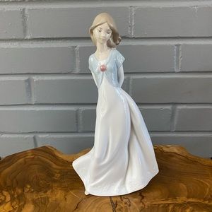 NAO hand made porcelain by lladro girl with slippers behind her back